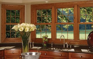 double hung window overseeing a garden