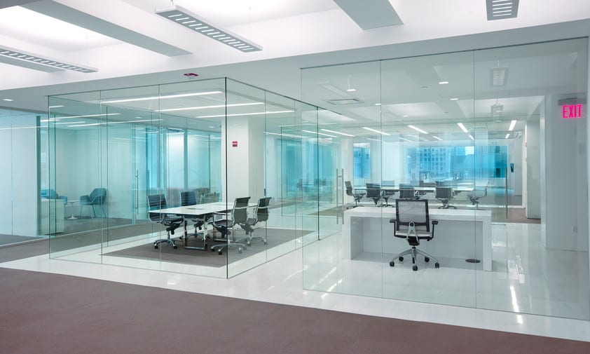 framless glass partitioned meeting rooms in office