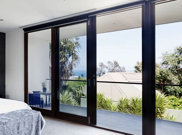 sliding glass doors installed in a seaside home