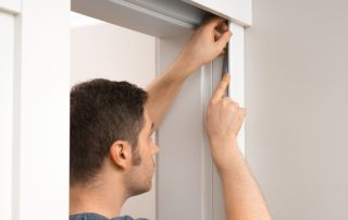 handyman installing aluminium sliding glass doors